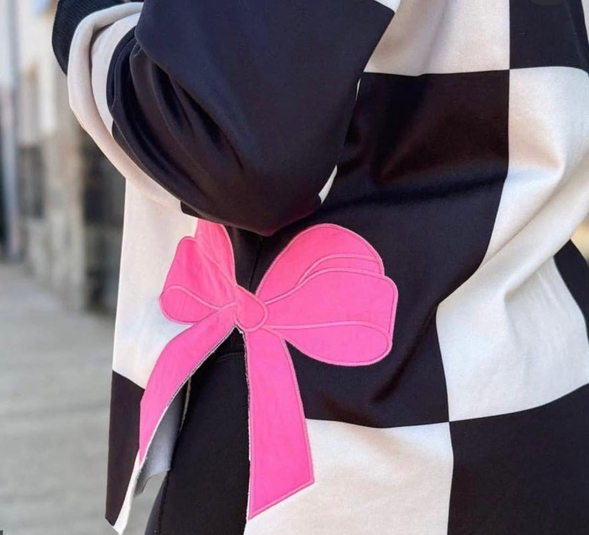 Bow’d & Bold Checkered Sweater